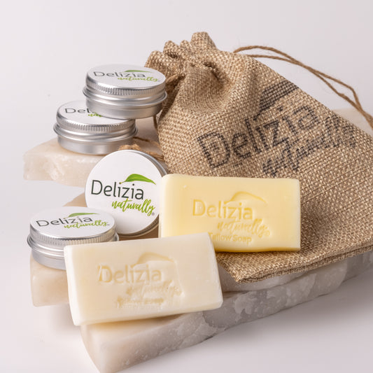 Tallow sample soap and cream set with a drawstring bag on a light background from Delizia Naturally