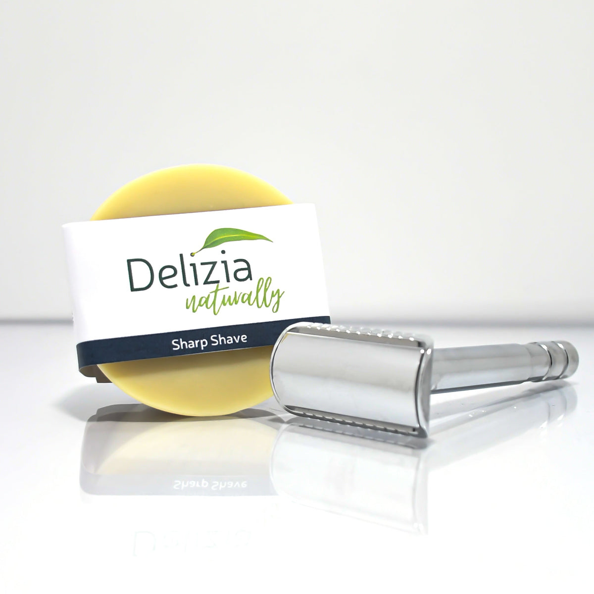 Sharp Shave shaving puck with razor by Delizia Naturally