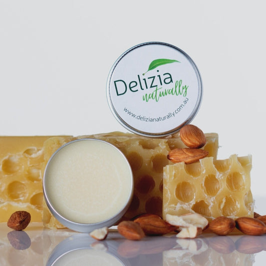 Delizia Naturally lip balm in a small tin.